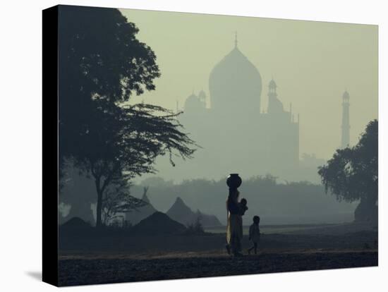 Taj Mahal with Woman and Child Silhouetted in Foreground at Dusk, Agra, Uttar Pradesh, India-David Beatty-Stretched Canvas