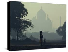 Taj Mahal with Woman and Child Silhouetted in Foreground at Dusk, Agra, Uttar Pradesh, India-David Beatty-Stretched Canvas