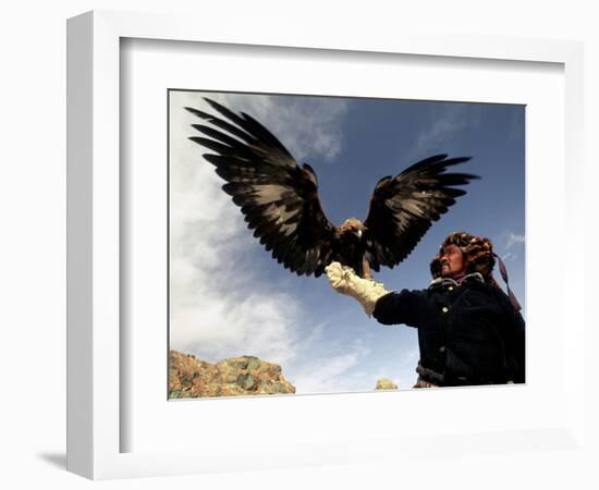 Takhuu Raising His Eagle, Golden Eagle Festival, Mongolia-Amos Nachoum-Framed Photographic Print