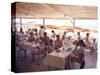 Taking Lunch in a Shaded Restaurant by the Shore in Juan Les Pins on the French Riviera, France-Ralph Crane-Stretched Canvas