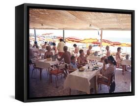 Taking Lunch in a Shaded Restaurant by the Shore in Juan Les Pins on the French Riviera, France-Ralph Crane-Framed Stretched Canvas