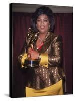 Talk Show Host Oprah Winfrey Holding Emmy Award-null-Stretched Canvas
