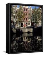 Tall Traditional Style Houses Reflected in the Water of a Canal, Amsterdam, the Netherlands-Richard Nebesky-Framed Stretched Canvas