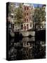 Tall Traditional Style Houses Reflected in the Water of a Canal, Amsterdam, the Netherlands-Richard Nebesky-Stretched Canvas