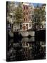 Tall Traditional Style Houses Reflected in the Water of a Canal, Amsterdam, the Netherlands-Richard Nebesky-Stretched Canvas