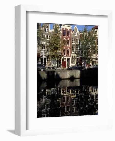 Tall Traditional Style Houses Reflected in the Water of a Canal, Amsterdam, the Netherlands-Richard Nebesky-Framed Photographic Print