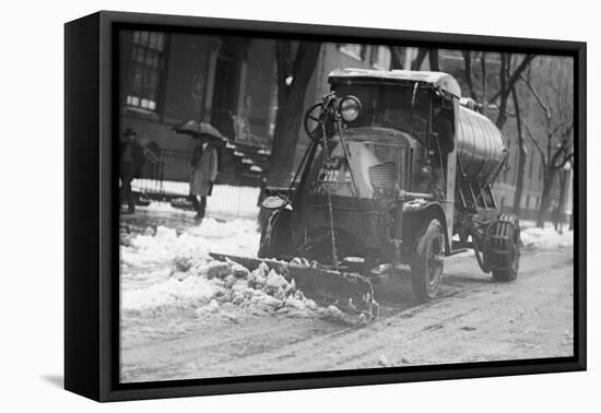 Tank Truck with Snow Plow Cleans the Streets-null-Framed Stretched Canvas