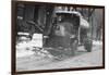 Tank Truck with Snow Plow Cleans the Streets-null-Framed Art Print