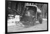 Tank Truck with Snow Plow Cleans the Streets-null-Framed Art Print