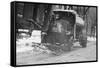 Tank Truck with Snow Plow Cleans the Streets-null-Framed Stretched Canvas