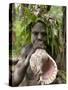 Tanna Island Fetukai, Native Dress-Young Boy with Sea Shell Horn, Vanuatu-Walter Bibikow-Stretched Canvas