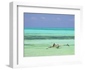 Tanzania, Zanzibar, Unguja, Jambiani, a Man Sits on His Boat Near the Shore-Nick Ledger-Framed Photographic Print