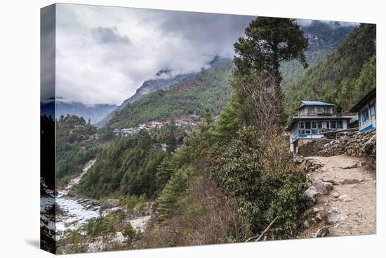 Teahouses along a trail next to river.-Lee Klopfer-Stretched Canvas