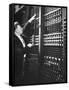 Technician Manipulating 1 of Hundreds of Dials on Panel of IBM's Room Size Eniac Computer-Francis Miller-Framed Stretched Canvas