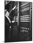 Technician Manipulating 1 of Hundreds of Dials on Panel of IBM's Room Size Eniac Computer-Francis Miller-Mounted Photographic Print