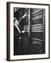 Technician Manipulating 1 of Hundreds of Dials on Panel of IBM's Room Size Eniac Computer-Francis Miller-Framed Photographic Print