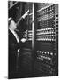 Technician Manipulating 1 of Hundreds of Dials on Panel of IBM's Room Size Eniac Computer-Francis Miller-Mounted Photographic Print