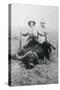 Teddy Roosevelt Sitting on Dead Water Buffalo with Rifle-null-Stretched Canvas