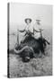 Teddy Roosevelt Sitting on Dead Water Buffalo with Rifle-null-Stretched Canvas