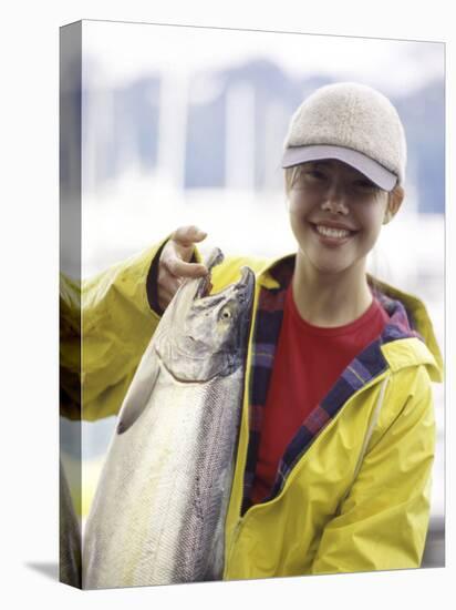 Teen Girl Holding a Fish-null-Stretched Canvas