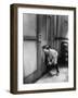 Teenage Boy Peeping Through Keyhole-null-Framed Photo