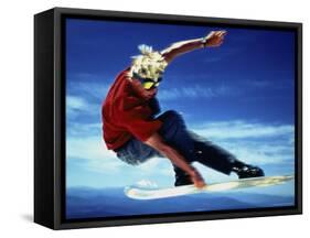 Teenage Boy Snowboarding in Mid-Air-null-Framed Stretched Canvas