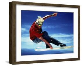 Teenage Boy Snowboarding in Mid-Air-null-Framed Photographic Print