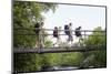 Teenage Boys and Girls with Backpacks Walking on Bridge in Forest-Nosnibor137-Mounted Photographic Print