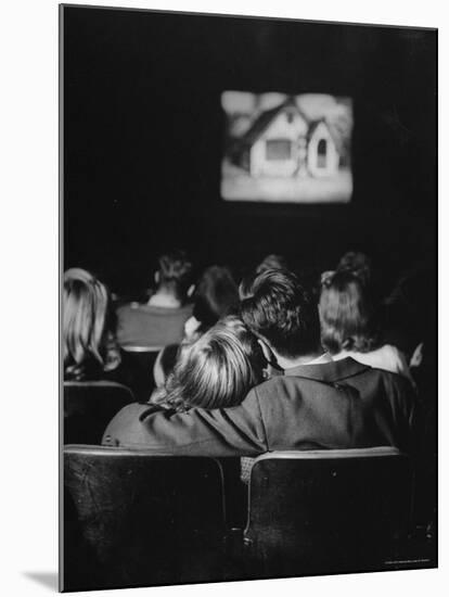 Teenage Couple Necking in a Movie Theater-Nina Leen-Mounted Photographic Print