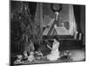 Teenage Girl Reading Book with Christmas Tree-null-Mounted Photo