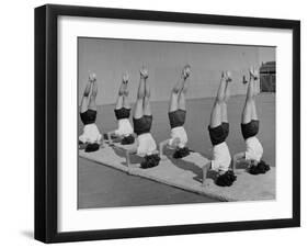 Teenage Girls from Hoover High School Standing on Their Heads in Gymnastics Class-Martha Holmes-Framed Photographic Print