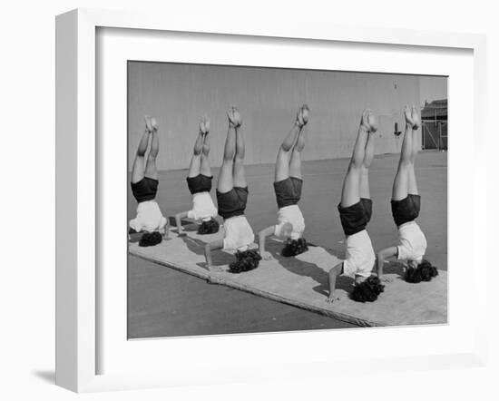 Teenage Girls from Hoover High School Standing on Their Heads in Gymnastics Class-Martha Holmes-Framed Photographic Print