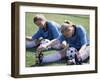 Teenage Girls in Soccer Uniforms Doing Stretching Exercises-null-Framed Premium Photographic Print