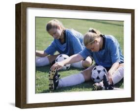 Teenage Girls in Soccer Uniforms Doing Stretching Exercises-null-Framed Photographic Print