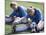 Teenage Girls in Soccer Uniforms Doing Stretching Exercises-null-Mounted Photographic Print