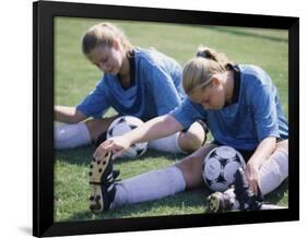 Teenage Girls in Soccer Uniforms Doing Stretching Exercises-null-Framed Photographic Print