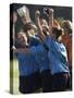 Teenage Girls on a Soccer Team Celebrating-null-Stretched Canvas