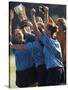 Teenage Girls on a Soccer Team Celebrating-null-Stretched Canvas
