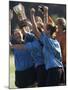 Teenage Girls on a Soccer Team Celebrating-null-Mounted Premium Photographic Print