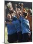 Teenage Girls on a Soccer Team Celebrating-null-Mounted Photographic Print
