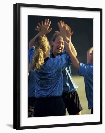 Teenage Girls on a Soccer Team Celebrating-null-Framed Photographic Print