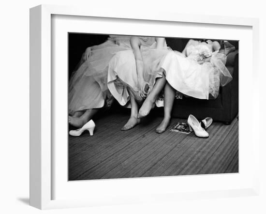 Teenage Girls Resting Feet at First Formal Dance at the Naval Armory-Cornell Capa-Framed Photographic Print