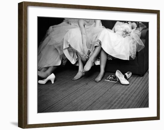 Teenage Girls Resting Feet at First Formal Dance at the Naval Armory-Cornell Capa-Framed Photographic Print