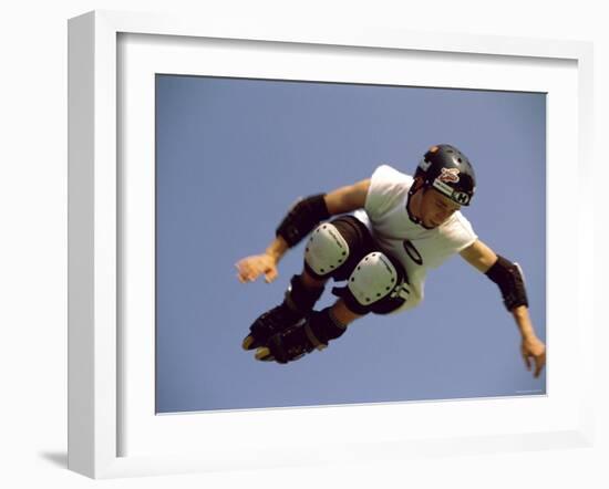 Teenager Inline Skating in Mid-Air-null-Framed Photographic Print