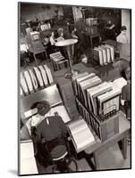 Telephone Operators Consulting Local and Long Distance Books and Directories, New York Telephone Co-Margaret Bourke-White-Mounted Photographic Print