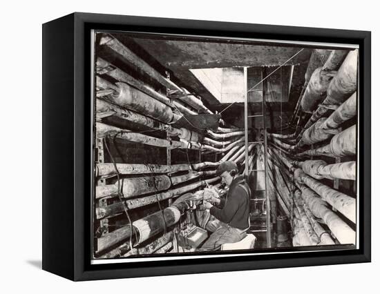 Telephone Repair Man Splicing a Wire in a Manhole for Telephone Cables of the New York Telephone Co-Margaret Bourke-White-Framed Stretched Canvas