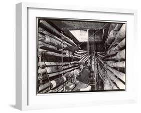 Telephone Repair Man Splicing a Wire in a Manhole for Telephone Cables of the New York Telephone Co-Margaret Bourke-White-Framed Photographic Print