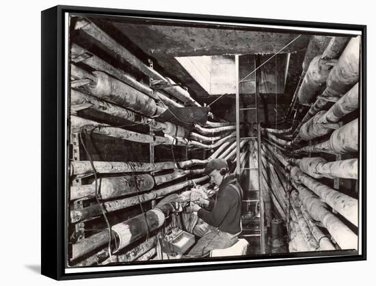 Telephone Repair Man Splicing a Wire in a Manhole for Telephone Cables of the New York Telephone Co-Margaret Bourke-White-Framed Stretched Canvas