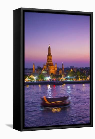 Temple of Dawn (Wat Arun) and Bangkok, Thailand-Jon Arnold-Framed Stretched Canvas