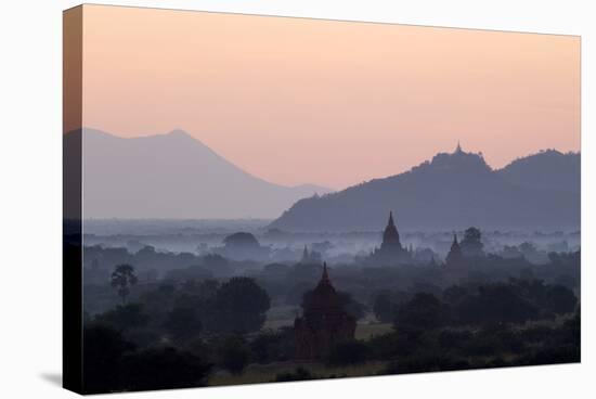 Temples, Pagodas and Stupas in Early Morning Mist at Sunrise, Bagan (Pagan), Myanmar (Burma)-Stephen Studd-Stretched Canvas